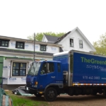The Green Cocoon truck outside of new home