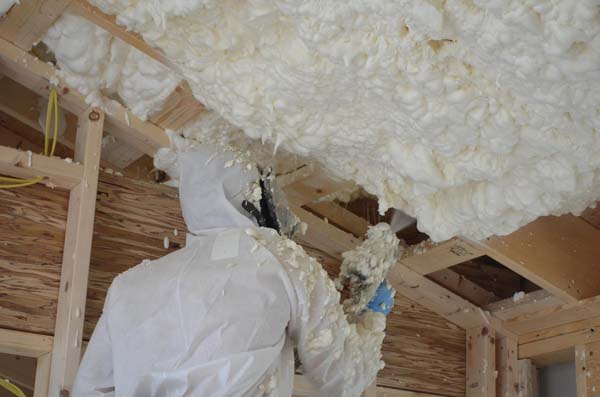 closed cell spray foam insulation ma person spraying